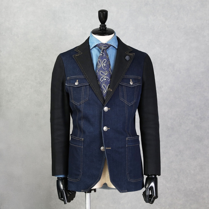 Thoma Gジャンを思わせるポケットに別生地を切り返した大胆なデザインが特徴