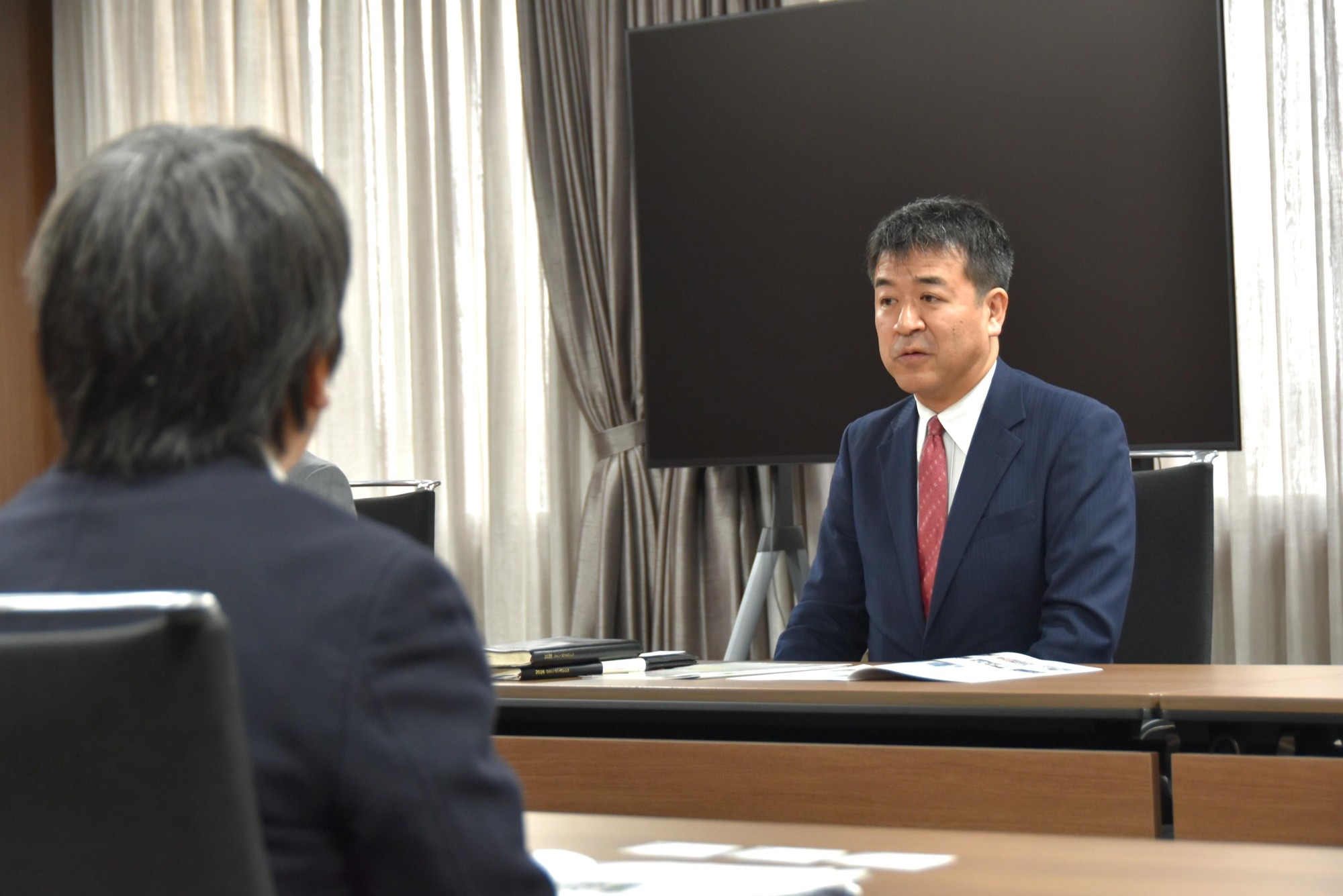 JICAの事業を紹介する上町所長