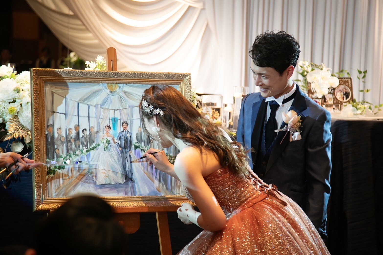 披露宴新郎新婦による筆入れで、更に特別な一枚に